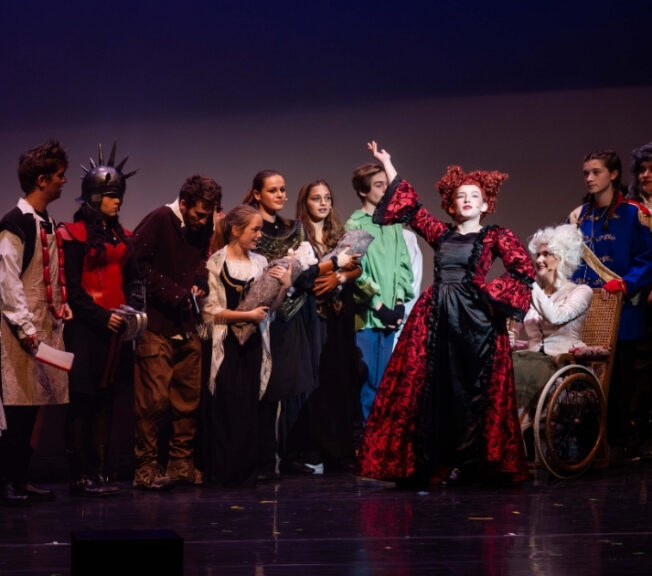 The cast of The Ballad of Raggedy Alice sing and dance on stage