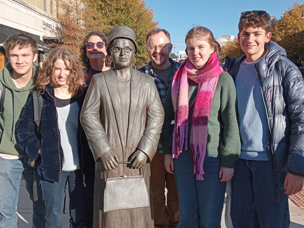 Students from The King Alfred School Sixth Form stand next to a statue of African American activist Rosa Parks