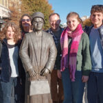 Students from The King Alfred School Sixth Form stand next to a statue of African American activist Rosa Parks