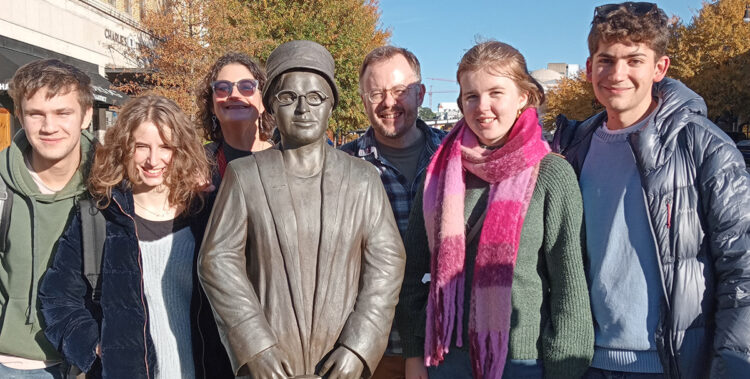 Students from The King Alfred School Sixth Form stand next to a statue of African American activist Rosa Parks