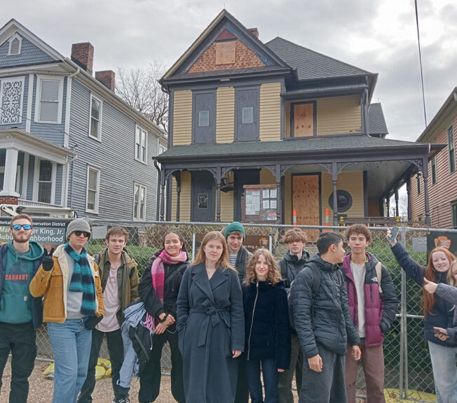 Students line up in front of a two-story Queen Anne Victorian style home at 501 Auburn Avenue in Atlanta, Georgia