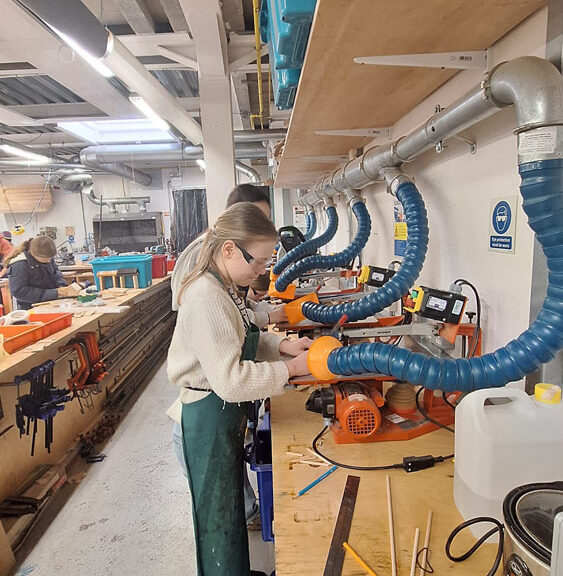 Students using the jigsaws in the Design Technology workshops at The King Alfred School North London