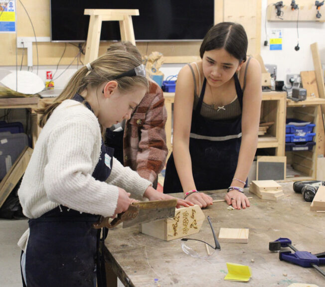 Students using saws in the Design Technology Department